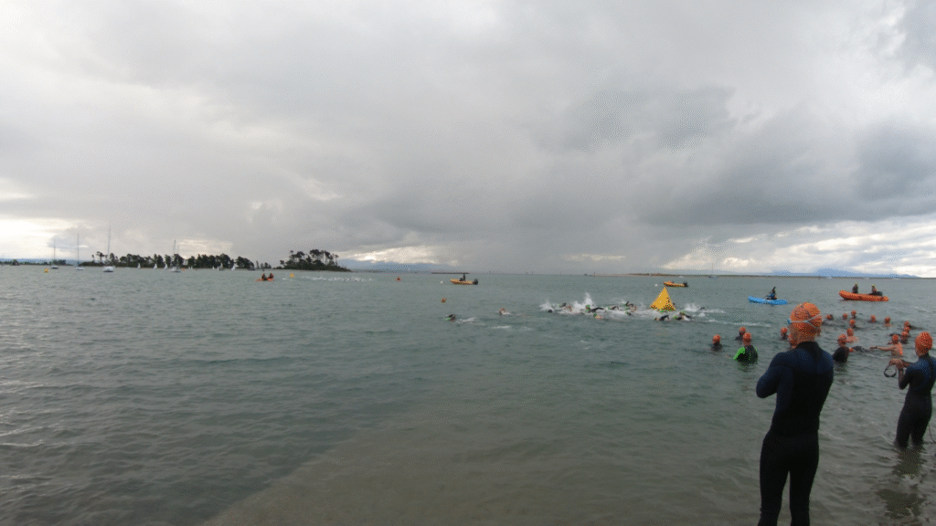 Season opener under sunny-grey skies with 102 swimmers and strong starts across all divisions.